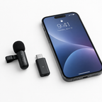 Wireless lavalier microphone and USB-C receiver flat lay next to smartphone on white surface